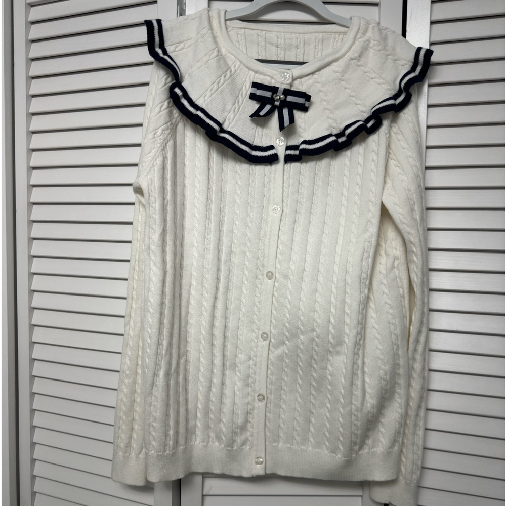 Big girl brand new button up sweater with a bow detail.